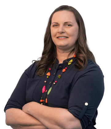 Photo of Corie Tyler smiling with arms crossed